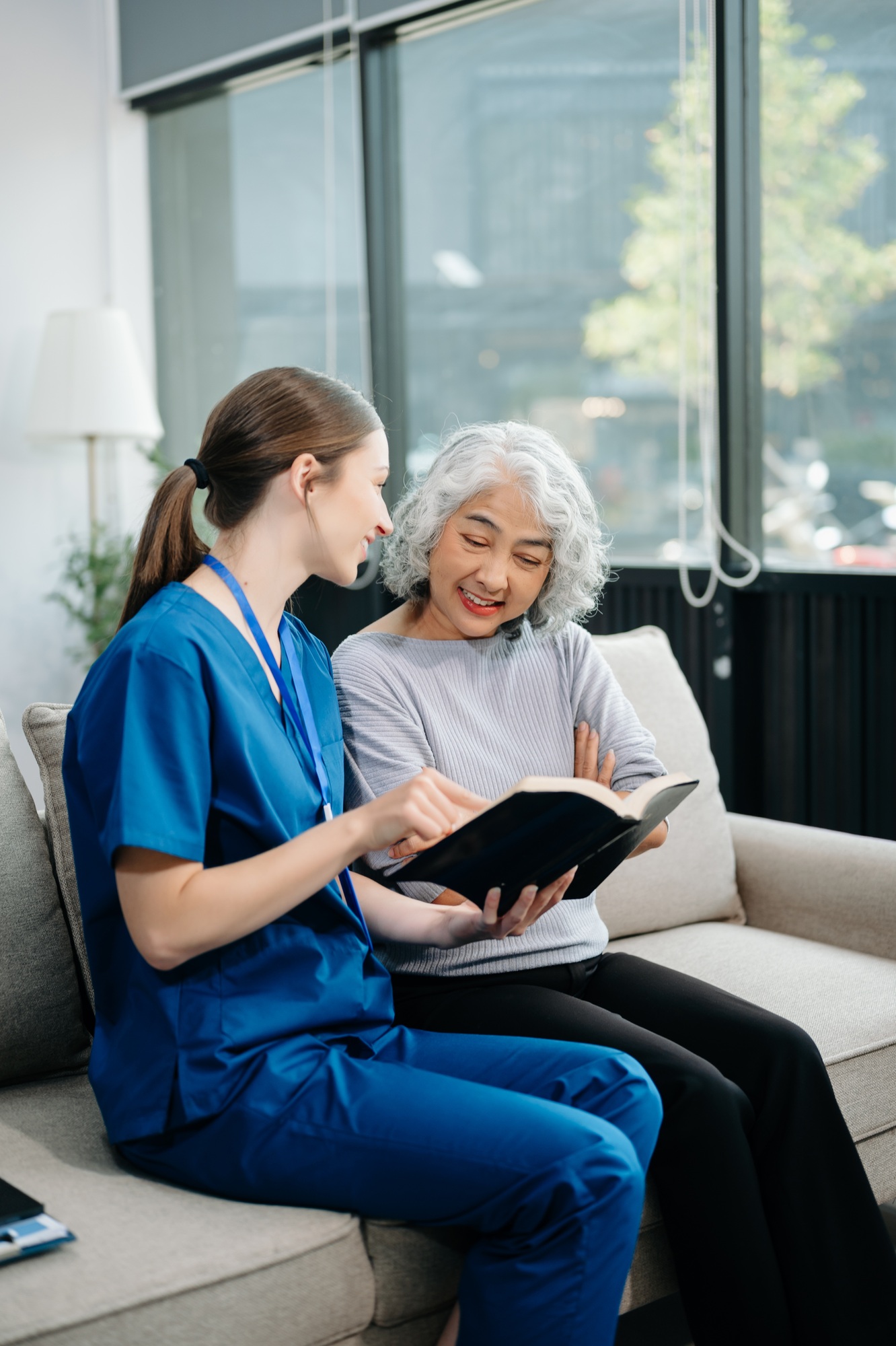 Caregiver doctor examine older patient use blood pressure gauge. woman therapist nurse at nursing