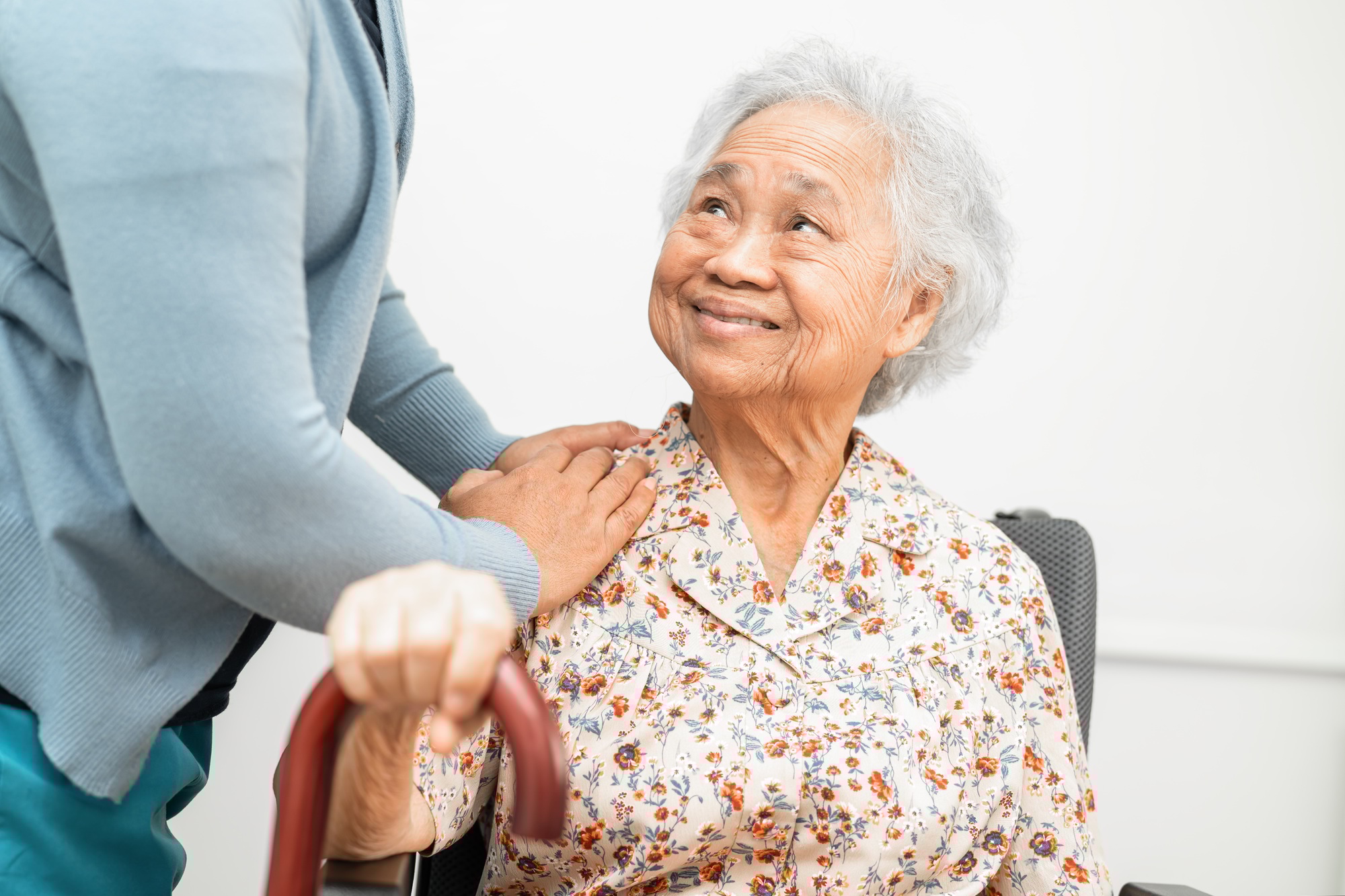 Caregiver help Asian elderly woman patient with love, care, encourage and empathy